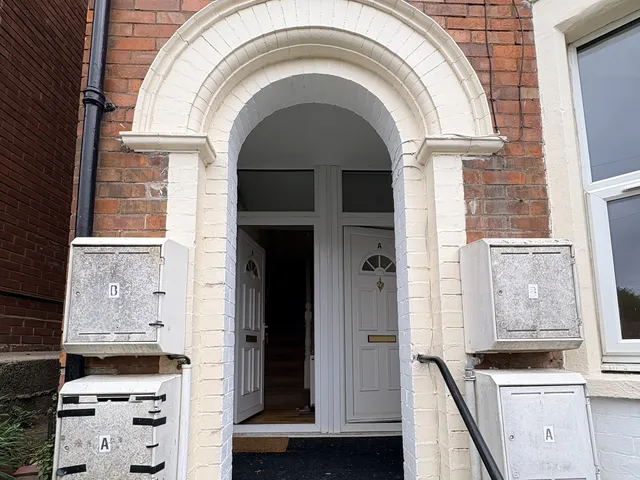 Shared entrance of a house converted into two flats, with separate front doors for Flat A and Flat B